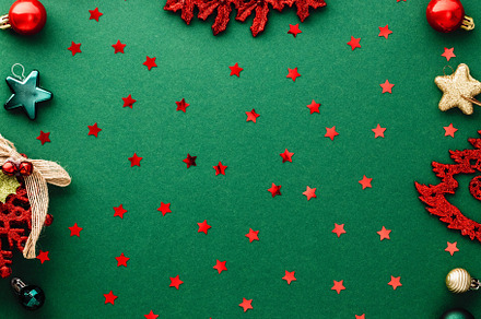 Vintage red Christmas decorations, wreath, balls, snowflakes on green backgroun, a Holiday Photo by photoguns