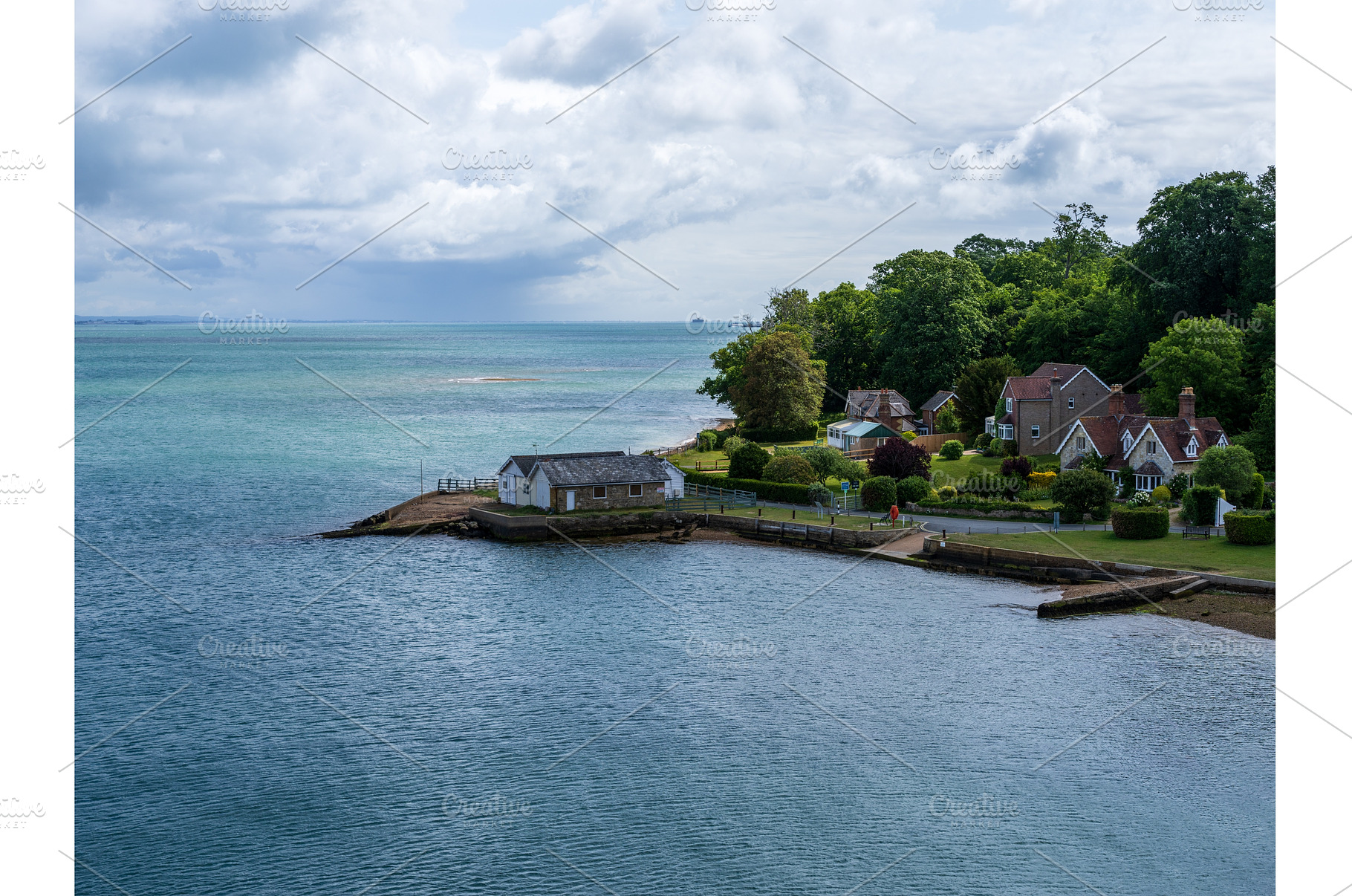 Houses along the shore by Fishbourne, an Architecture Photo by Backyard Stock