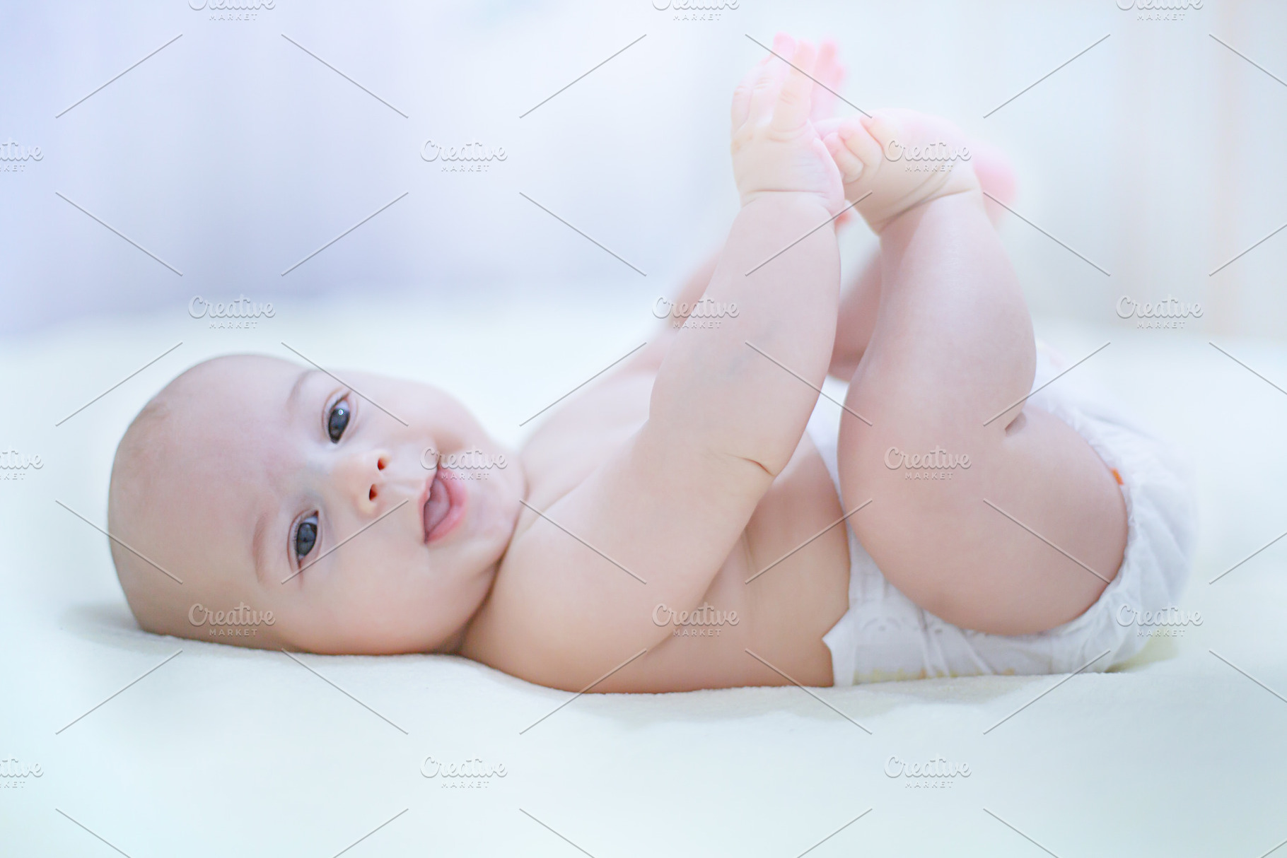 Happy kid wearing a diaper containing baby, bath, and bed, a Person Photo by Rodica Ciorba