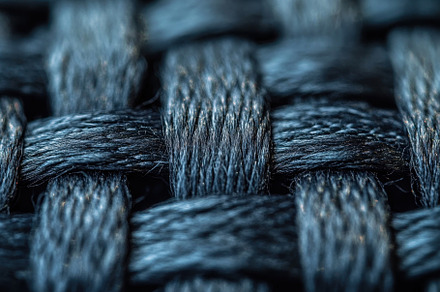 A detailed view of a woven fabric sh, a Photo by Tanuart