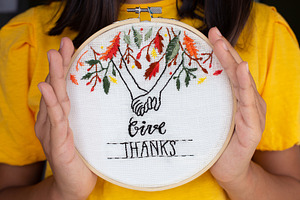 Girl showing her embroidery for Than