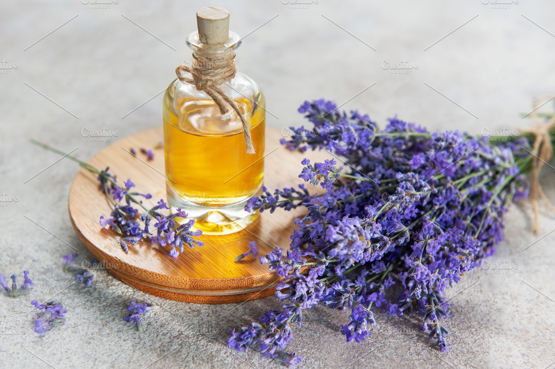 Lavender essential oil bottle with fresh flowers, a Health & Medical Photo by Olena Rudo