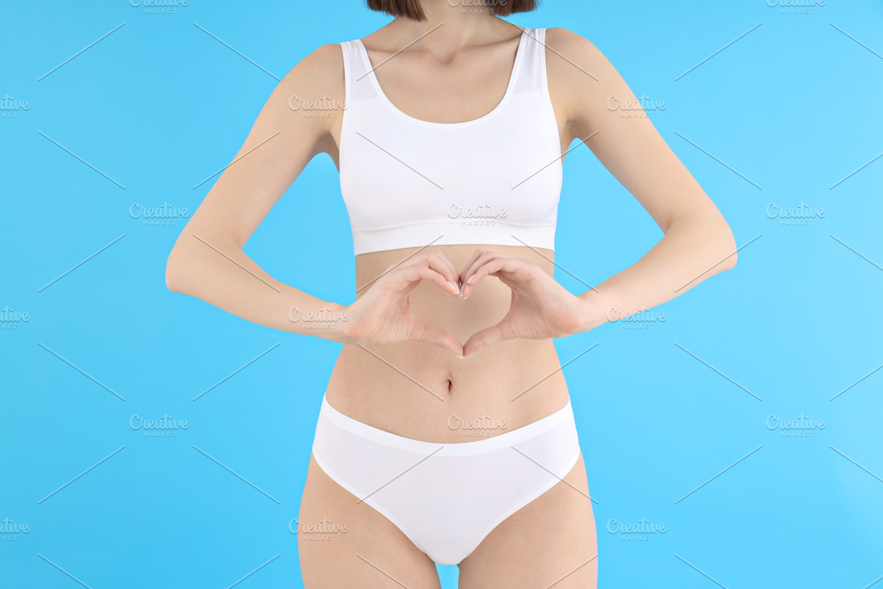 Concept of weight loss, young woman on blue background, a Person Photo by AtlasStudio PRO