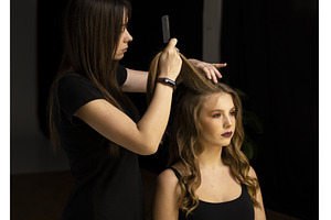 Hairdresser combing and lifting, a Beauty & Fashion Photo by volodymyrshtun13795