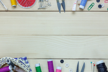 Tailor items on wooden containing abstract, accessories, and background, an Industrial Photo by OSABEE TOP VIEW