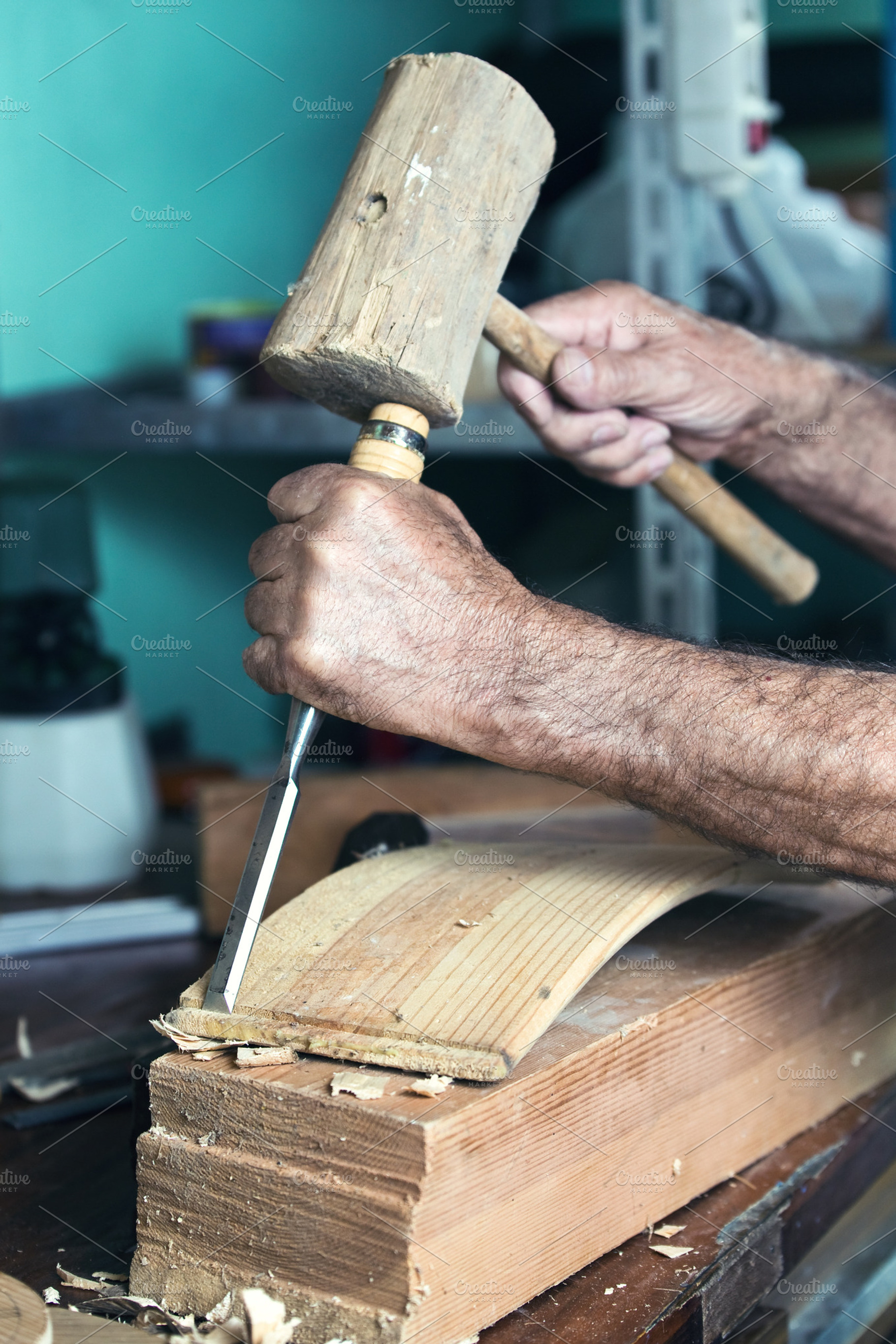 hands carpenter carving wood, a Person Photo by angellodeco