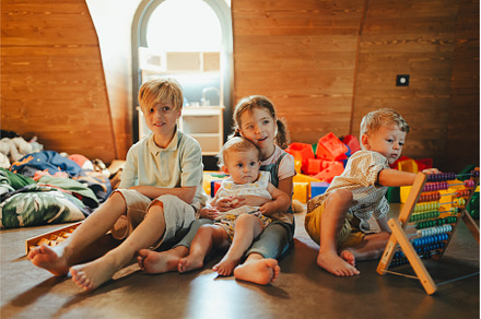 Children are playing together in, an Architecture Photo by HalfPoint