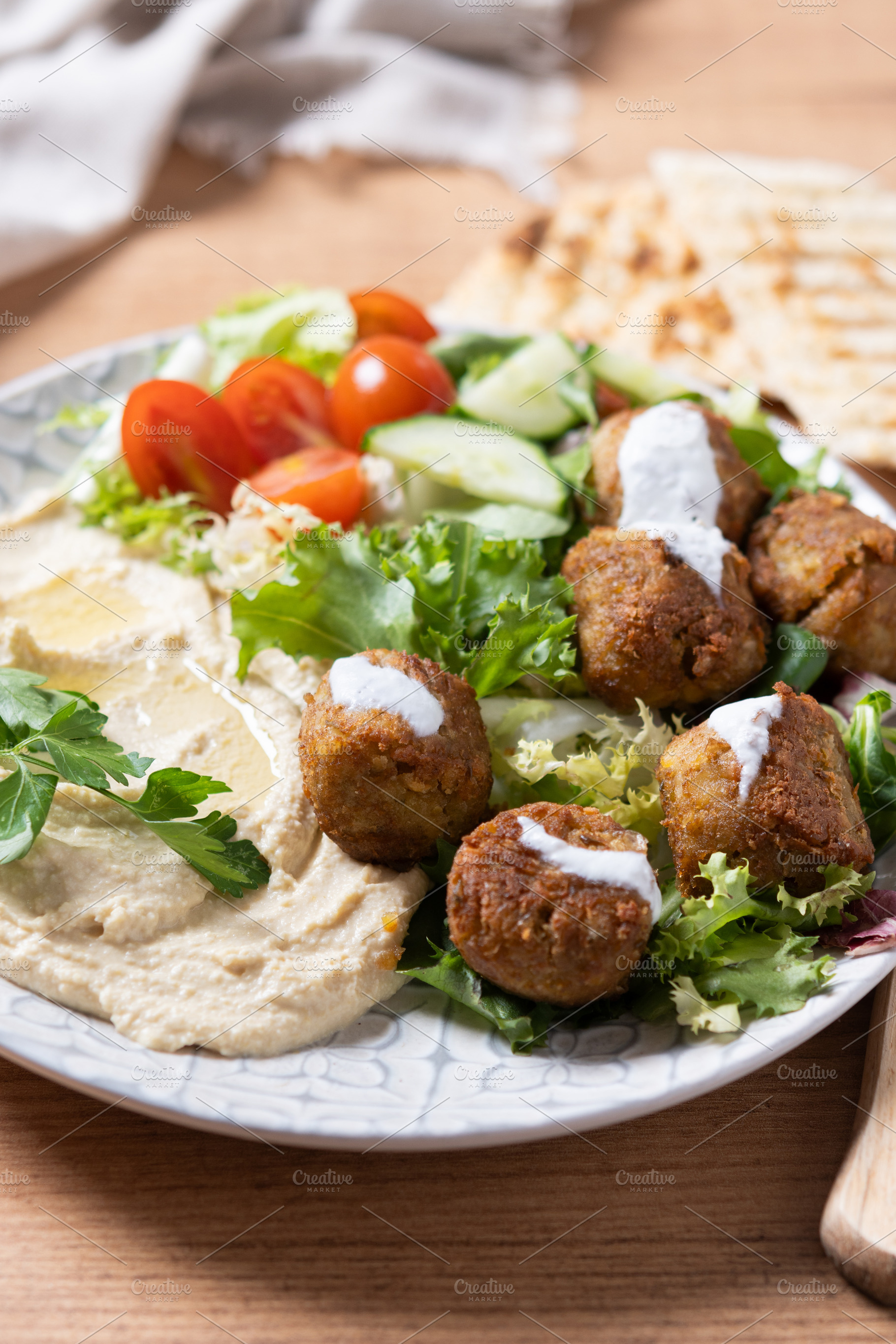 Falafel with hummus and fresh vegetable salad, a Food & Drink Photo by etorres69