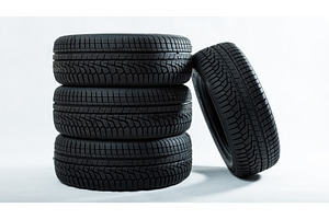 Stack of tires with one leaning