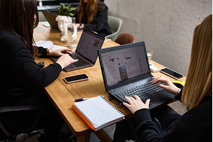 Women collaborating in modern, a Business Photo by wip3out