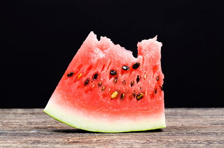 ripe watermelon with bright red beautiful flesh, a Photo by MyPhotos