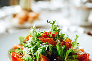 Gourmet salad with fresh vegetables and dried tomatoes served on, a Food & Drink Photo by Studio ANNA