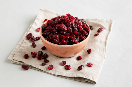 Organic Dried Cranberries in a Bowl, side view., a Food & Drink Photo by LiudmylaChuhunova