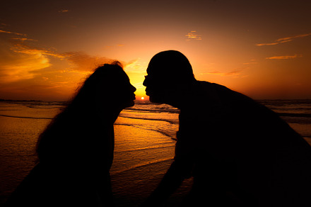 Silhouette couple kissing in sunset stock photo containing sunset and