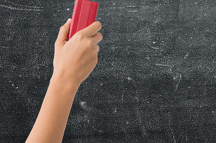 Hand holding brush eraser