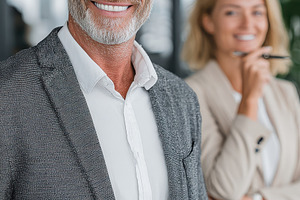 Smiling businessman holding tablet s, a Photo by Pixeness Studio
