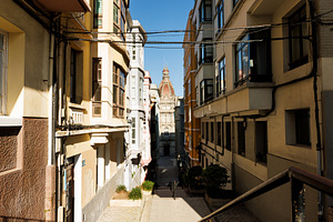 Street view with the Municipal Palace domes in La Coruna, Spain, an Architecture Photo by Bepslabor