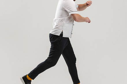 Portrait of cook, chef man in uniform running to kitchen isolated on white back, a Person Photo by Volodymyr Melnyk