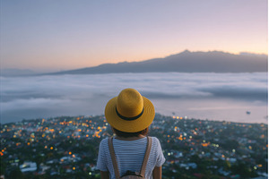 A woman stands at the top of Mount, a Person Photo by ZinetroN