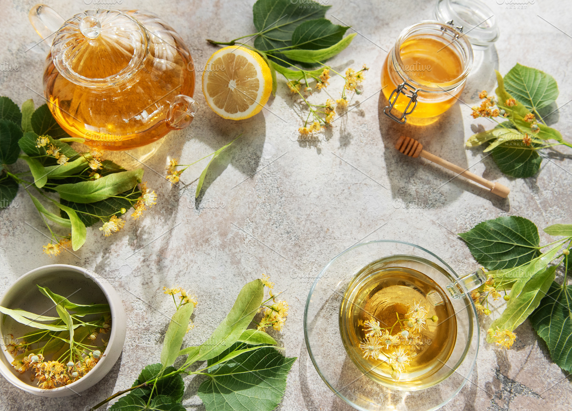 Linden tea preparing with fresh lime blossom and honey, a Food & Drink Photo by Olena Rudo