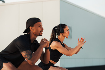 Two athletes are doing sit-ups, a Sports & Recreation Photo by Artem Varnitsin