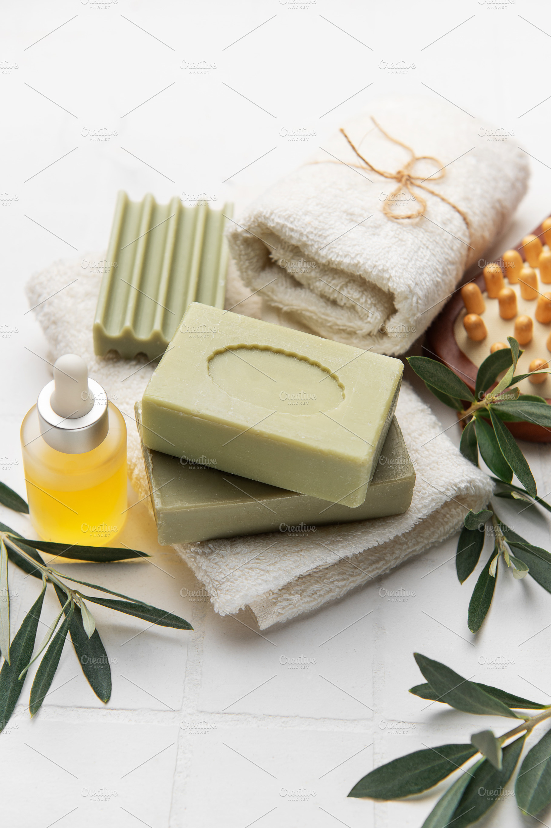 Natural olive oil soap, essential oil and white towels creating, a Health & Medical Photo by Olena Rudo