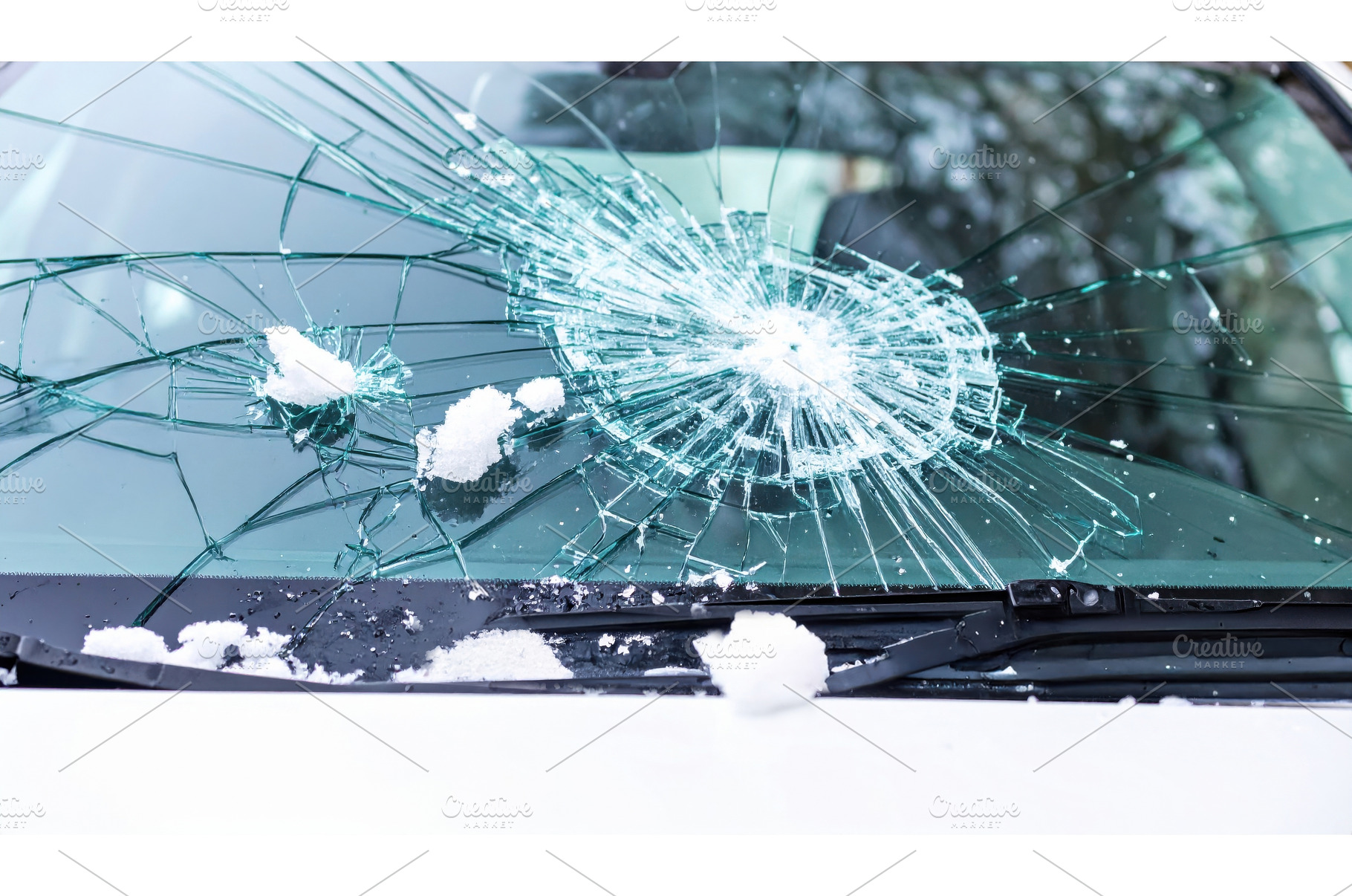 A cracked car windshield covered, a Transportation Photo by Igor Tichonow