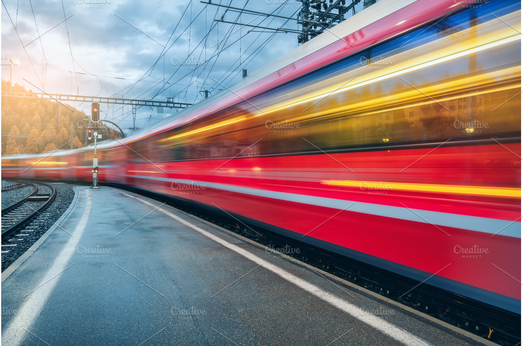 Blurred red passenger train passing, a Transportation Photo by den-belitsky
