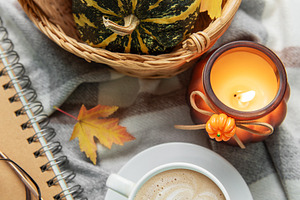 Autumn cozy moment with coffee, candle, and pumpkins, a Holiday Photo by Olena Rudo