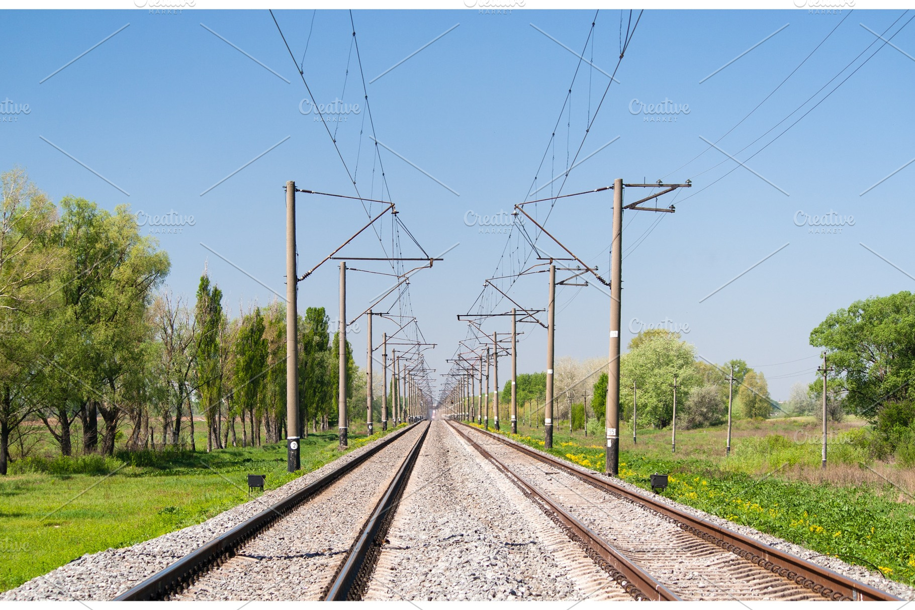 Double-track electrified (25 kV, 50 Hz) railway line, a Transportation Photo by Leonid Andronov