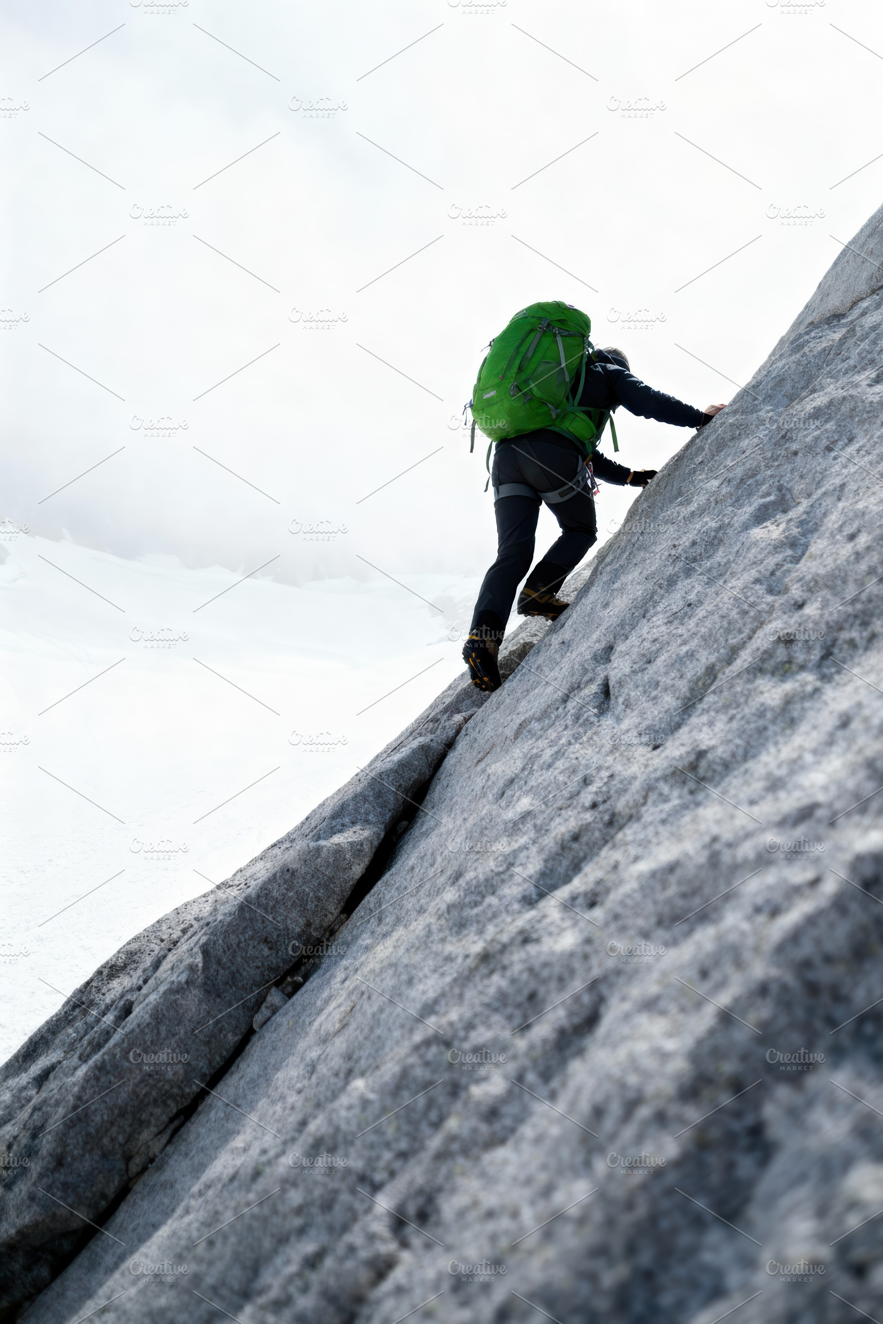 Determined Climber Ascending a Rocky, a Sports & Recreation Photo by Virgo Studio