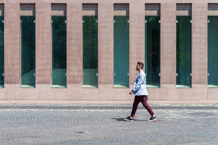 Young urban businessman professional walking in street wearing smart casual jac, a Person Photo by RF Images