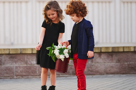 little boy and girl with big lilac