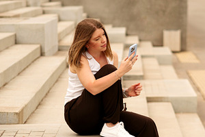 Young woman sitting on steps, a Person Photo by Elena Vagengeim