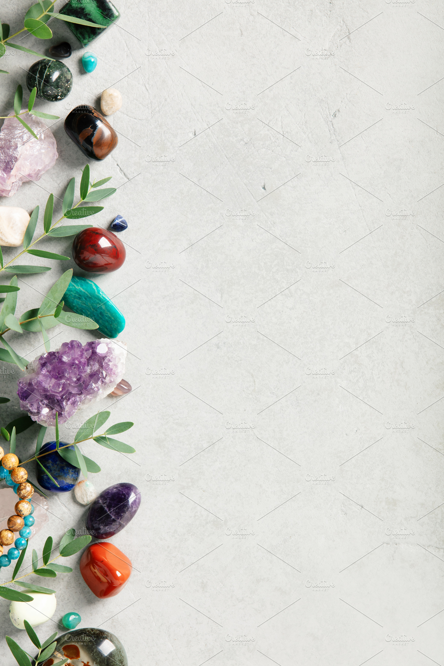 Healing Crystals and Green Leaves on Textured Concrete Backgroun, a Nature Photo by Natalia Klenova's Shop