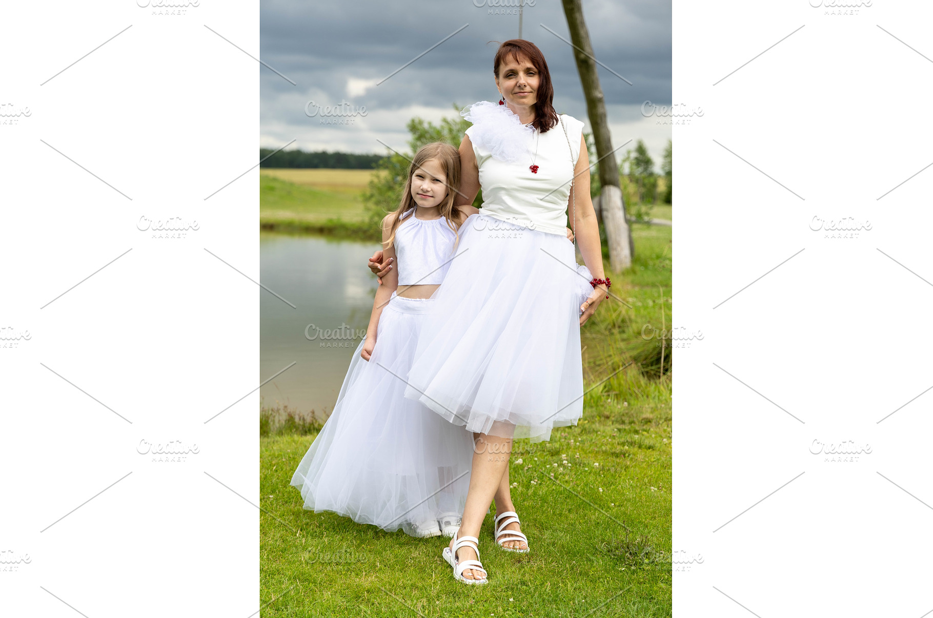 Mother and daughter in white in, a Person Photo by Nenahliadava Design