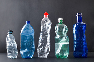 Row of plastic bottles isolated on a black background, a Nature Photo by Davizro's Market