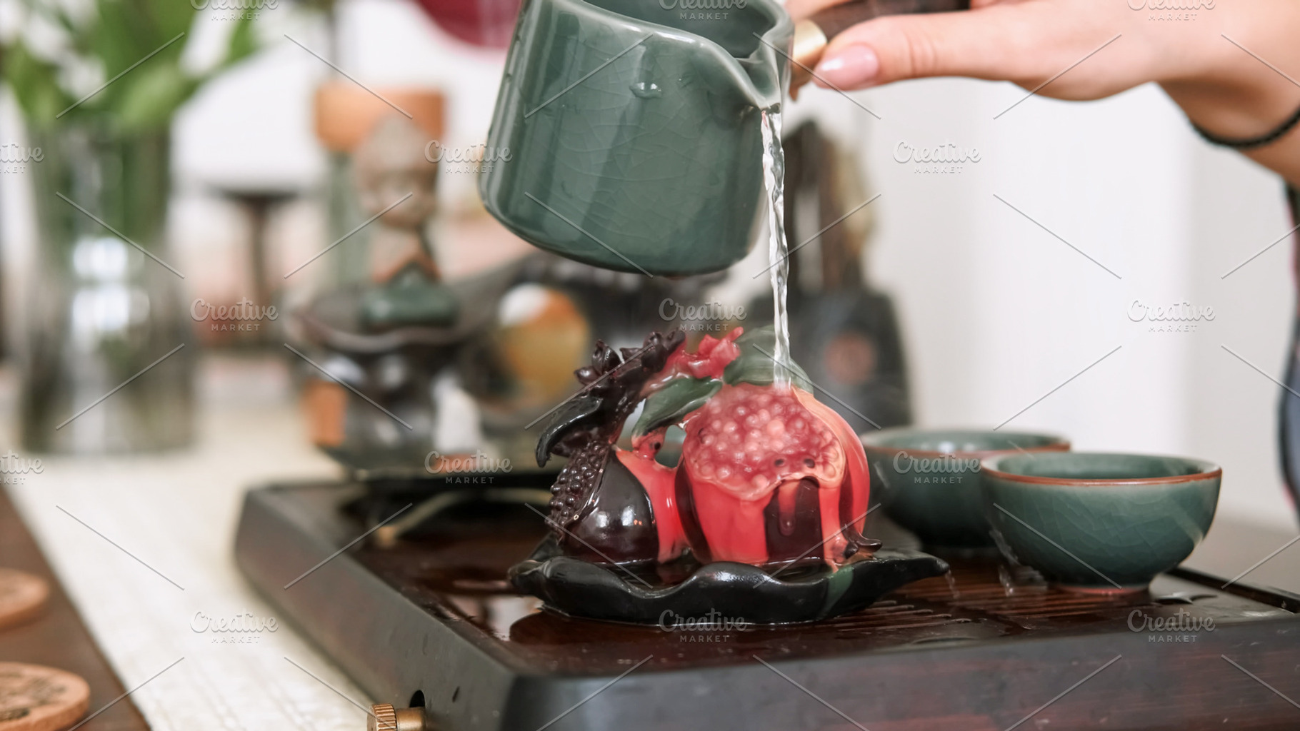 Pomegranate tea figurine chinese ceremony hand, a Person Photo by Photo Drive Studio