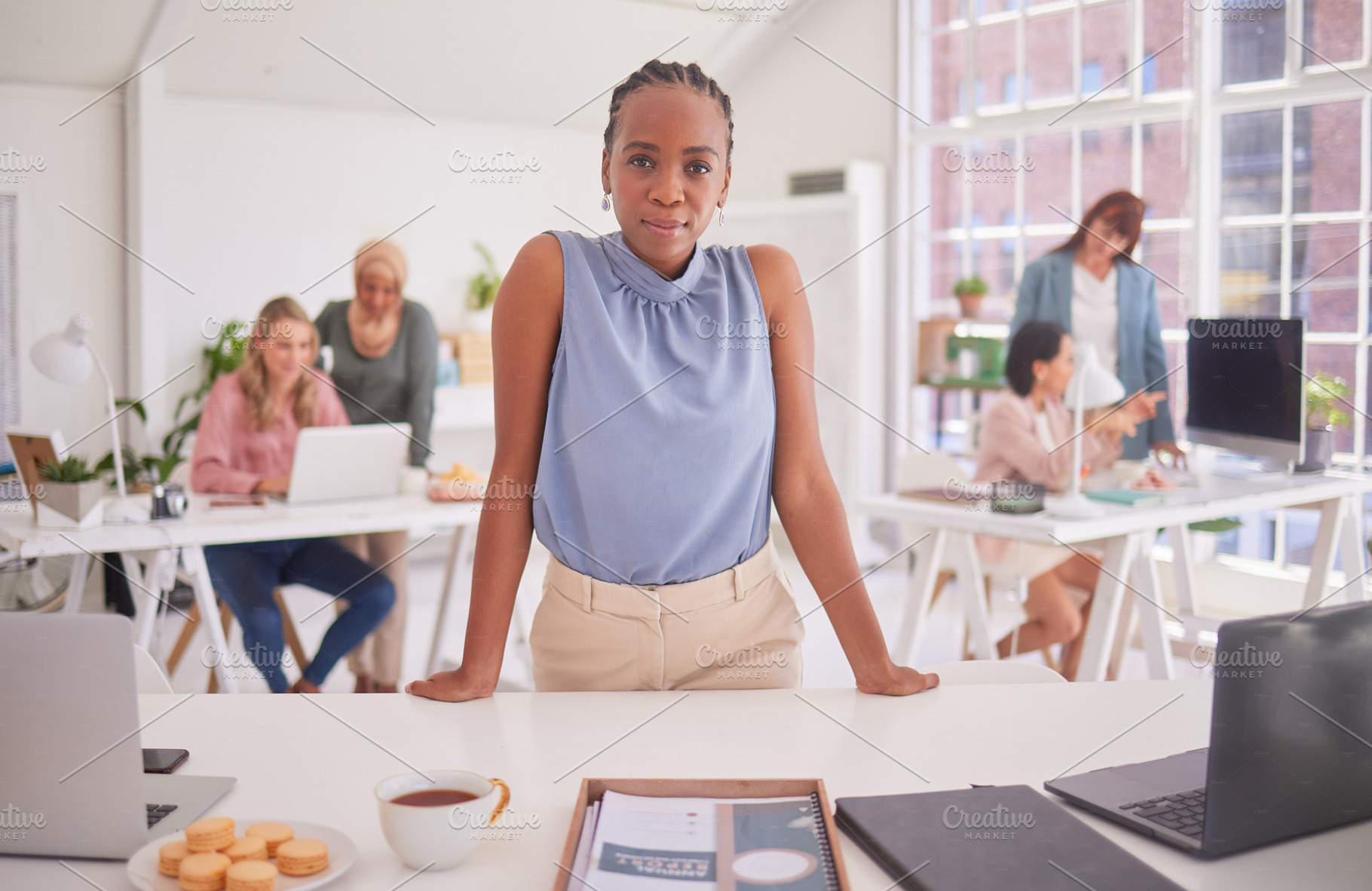 Meeting, office and portrait of an African woman in a modern office planning a corporate project. Professional, team and business people working together in a coworking space in the workplace., a Photo by Peopleimages.com