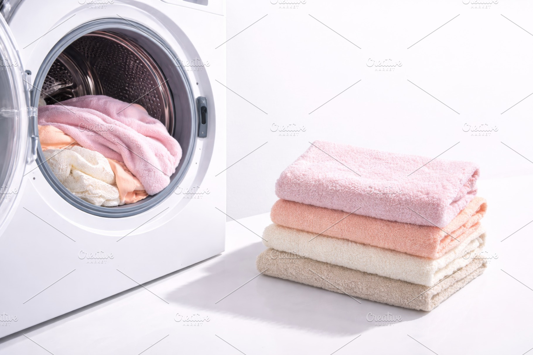 Laundry with stack of soft towels ne, a Photo by Dvoevnore photos