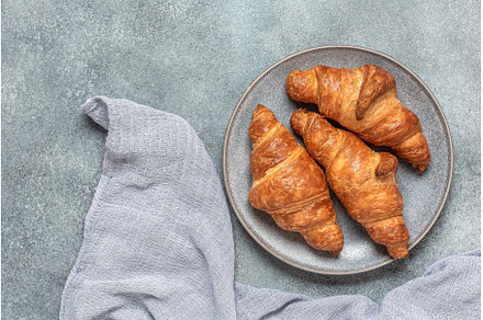 Fresh croissants close-up in a plate, a Food & Drink Photo by Yulia71