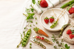 Strawberry and pea-themed accessorie, a Photo by Dvoevnore photos