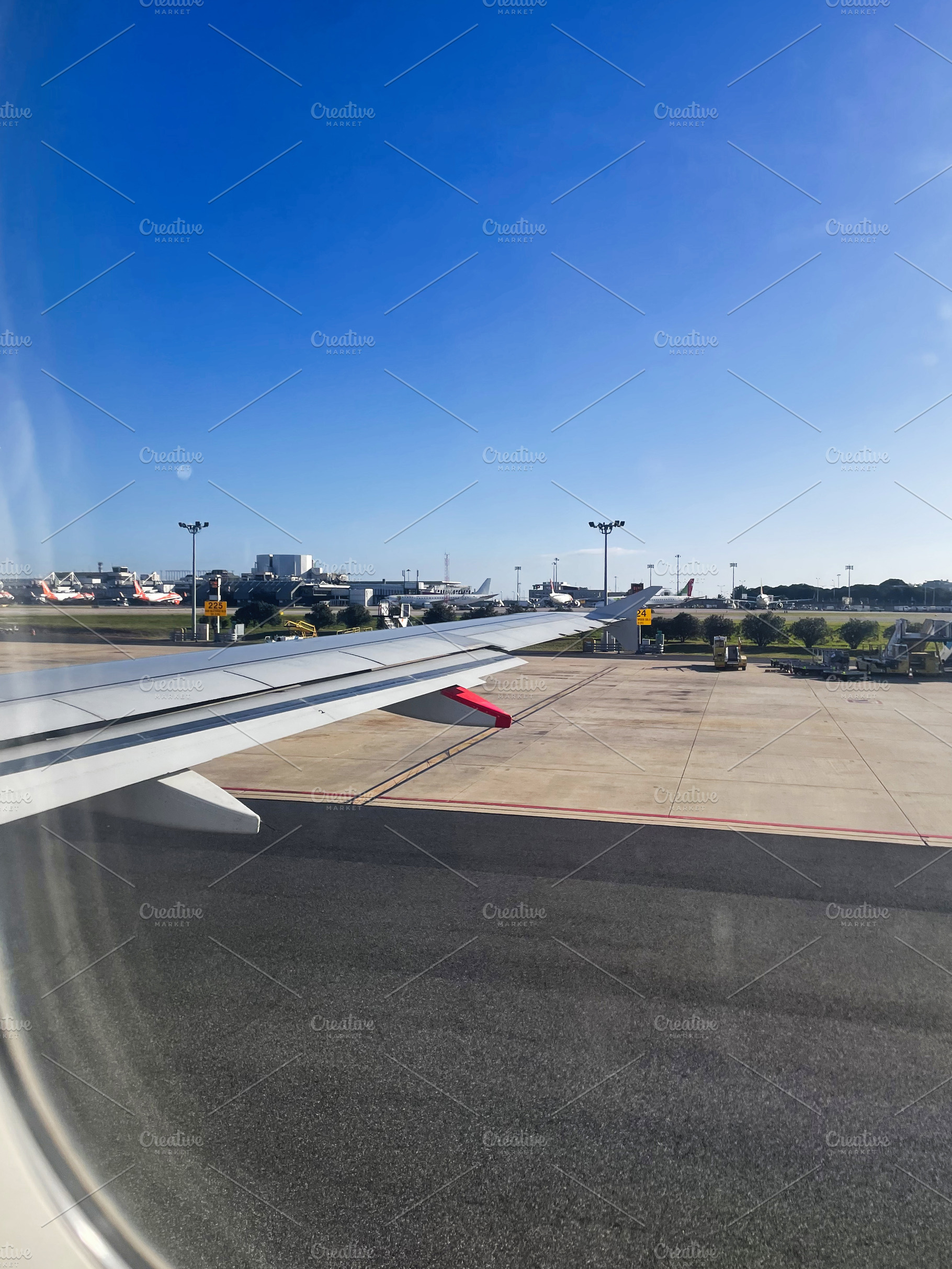 View from airplane window overlooking Sydney airport in Australia under clear b, a Photo by AS photostudio