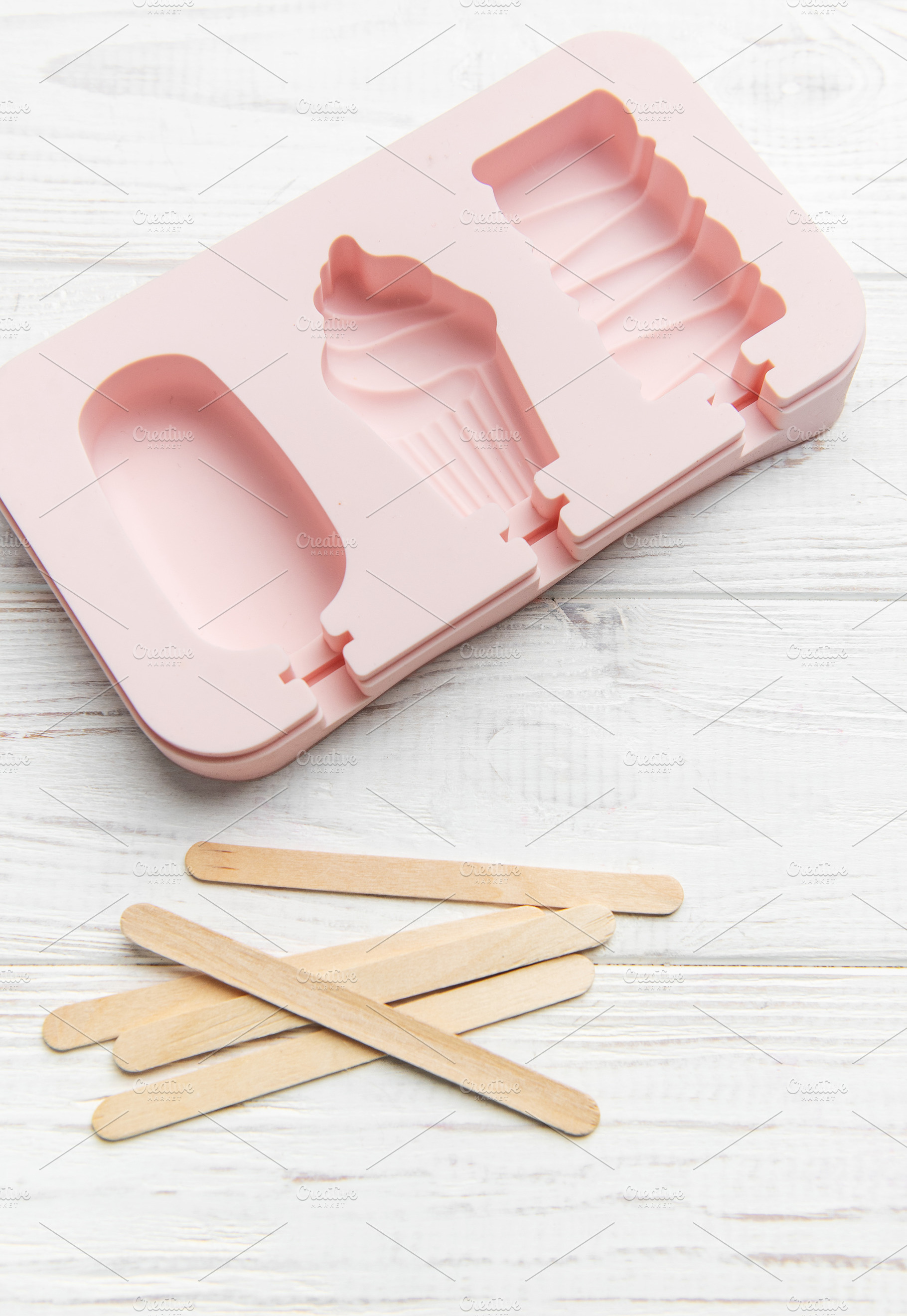 Pink silicone ice pop mold making summer treats, a Food & Drink Photo by Olena Rudo