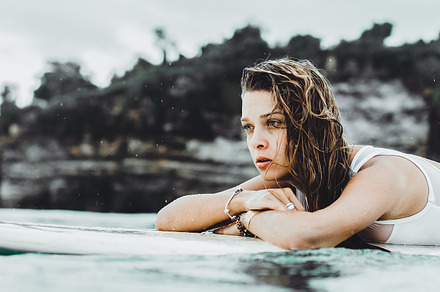 Girl on a surf board stock photo containing surfer and board, a Sports & Recreation Photo by EVA.studio
