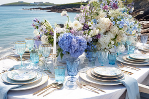 Elegant coastal table setting with floral arrangements, fine tab, a Holiday Photo by Studio ANNA