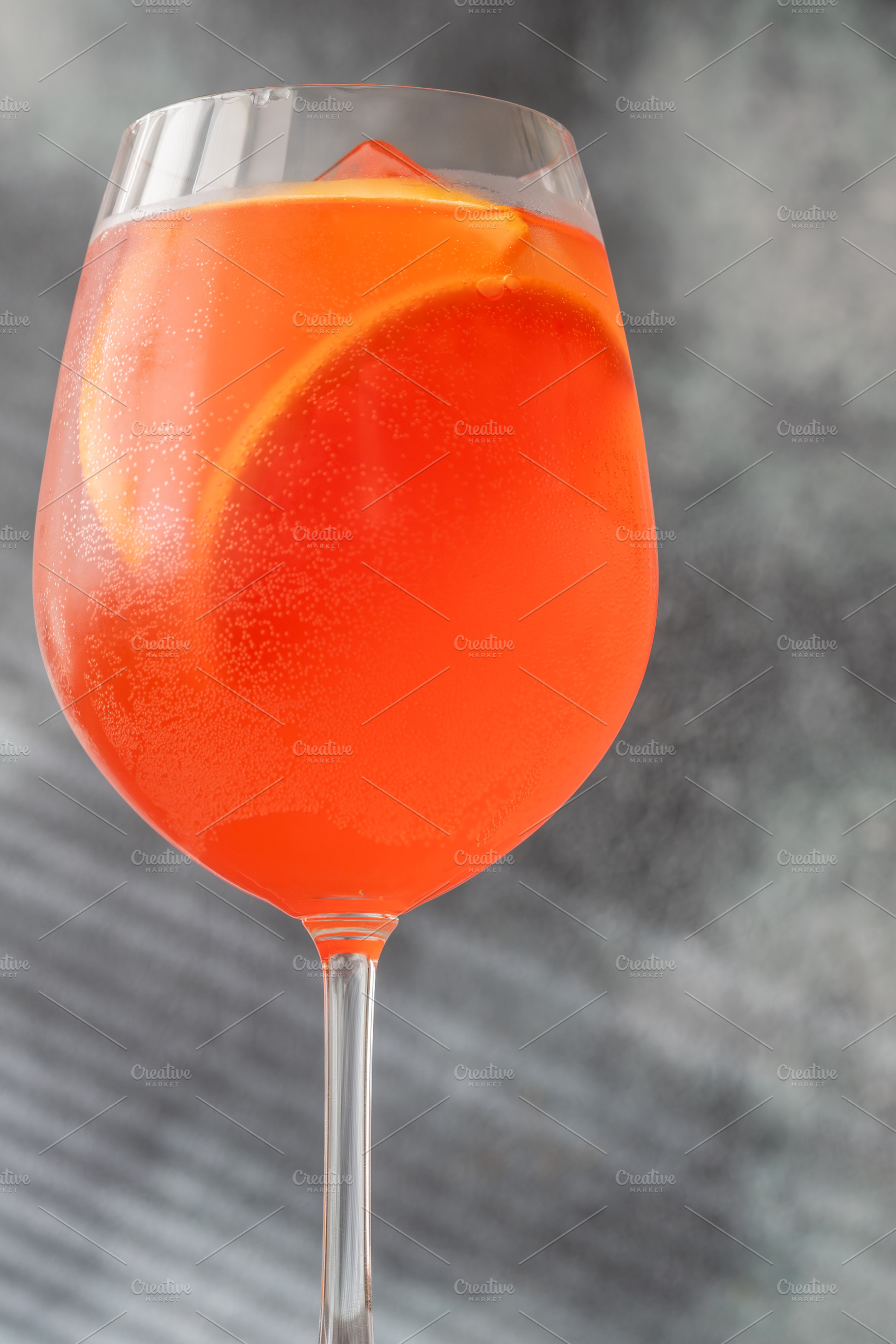 Vibrant Campari Spritz cocktail with citrus ice bubbles elegant, a Food & Drink Photo by Alexander Prokopenko