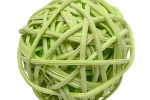 Green wicker rattan ball on white background, which is a decorat, a Photo by ndanko