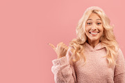 Wow, check this. Happy young lady pointing aside at free space for your design, a Photo by Prostock-Studio (Thumbnail 2 of 2)