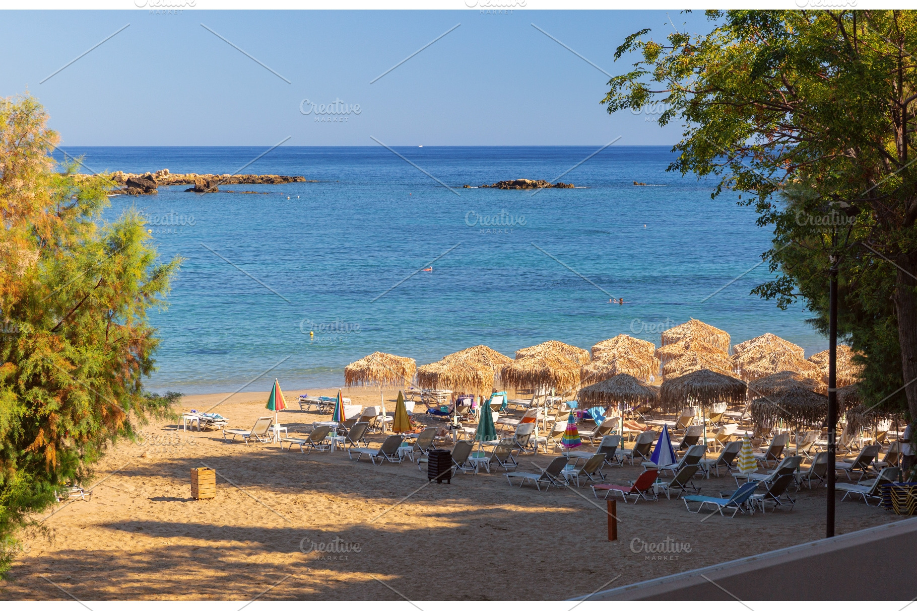 Sandy Beach with Thatched Parasols, a Nature Photo by kavalenkava